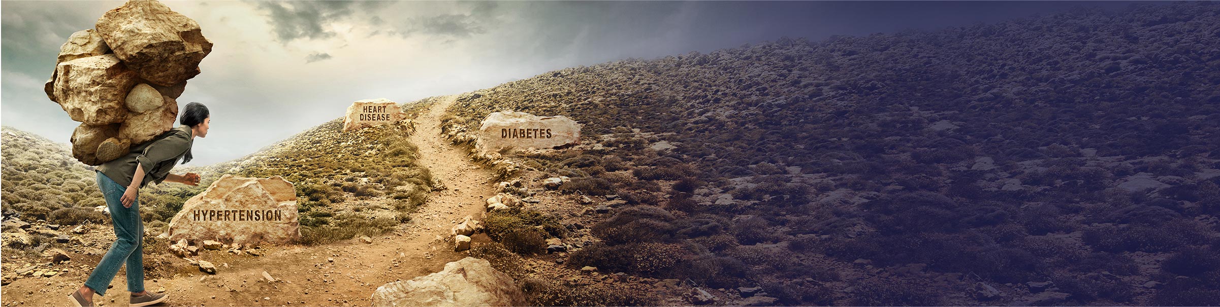 Clouds young woman walking rocky terrain carrying boulders on back