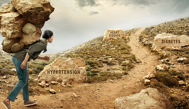 Clouds young woman walking rocky terrain carrying boulders on back